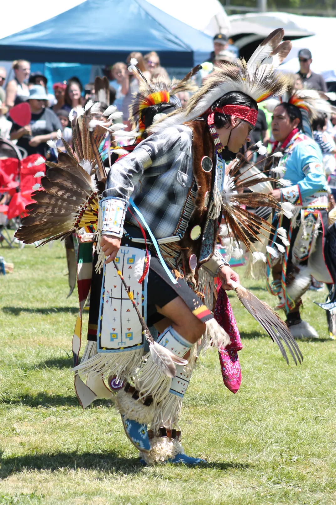 Native Americans participate in a traditional powwow.