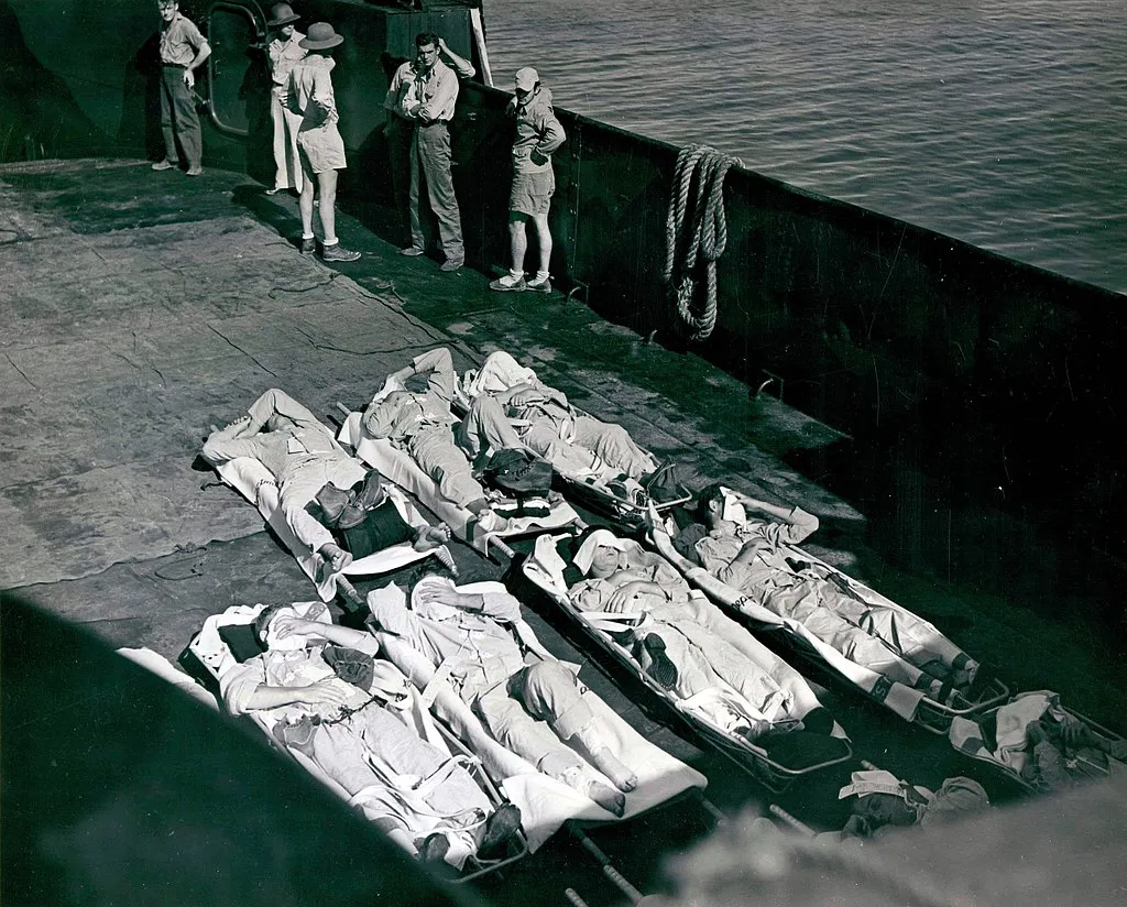 A landing craft transports survivors of the Indianapolis ashore for hospitalization on the island of Peleliu