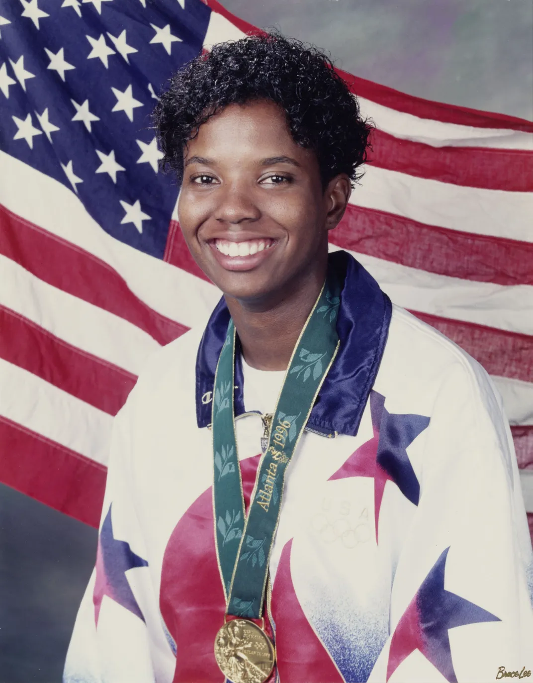 Briana Scurry wearing an Olympic gold medal