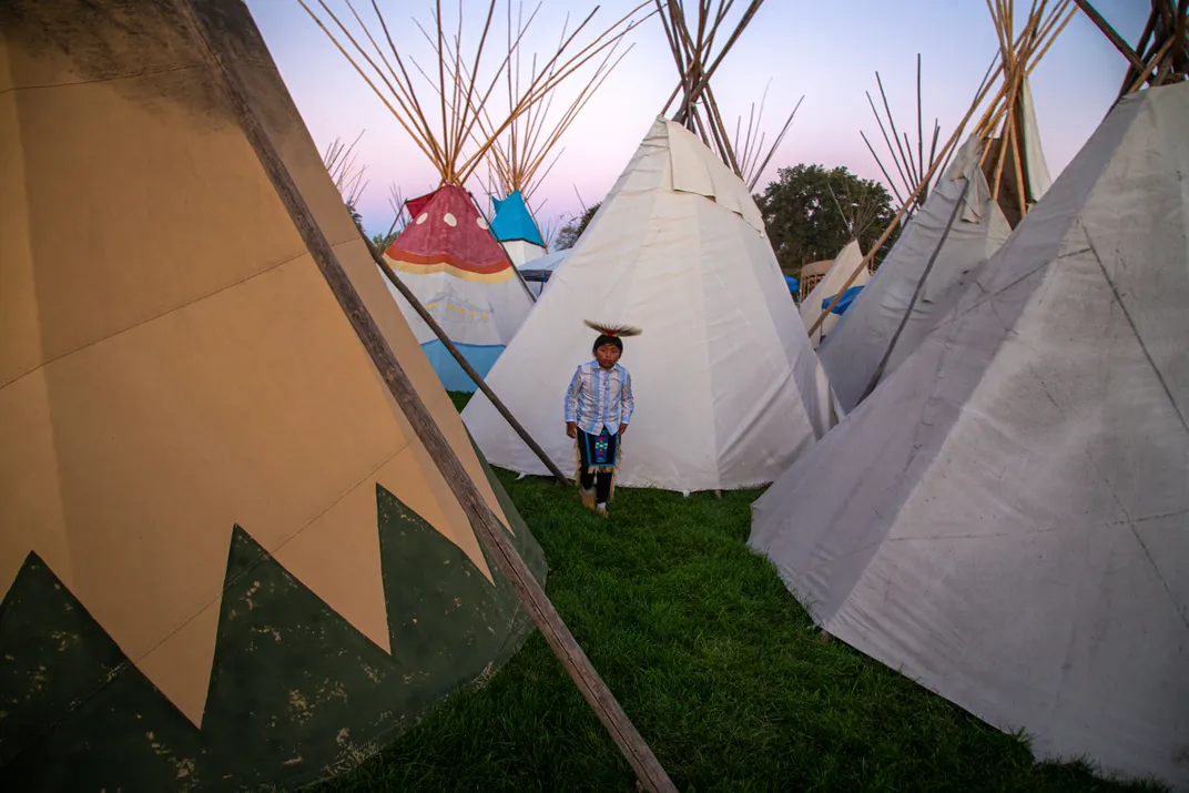 A young Yakama boy explores the annual Teepee Village at the Pendleton Round-Up