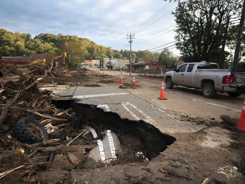 a washed out road from storm damage
