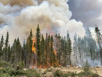 A wildfire burns in Quebec, Canada, in June of last year. Smoke from the fires drifted south to the United States.