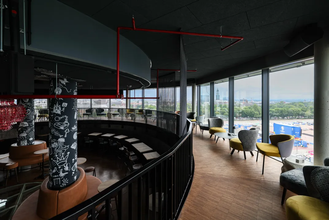 Dark restaurant area with lots of windows