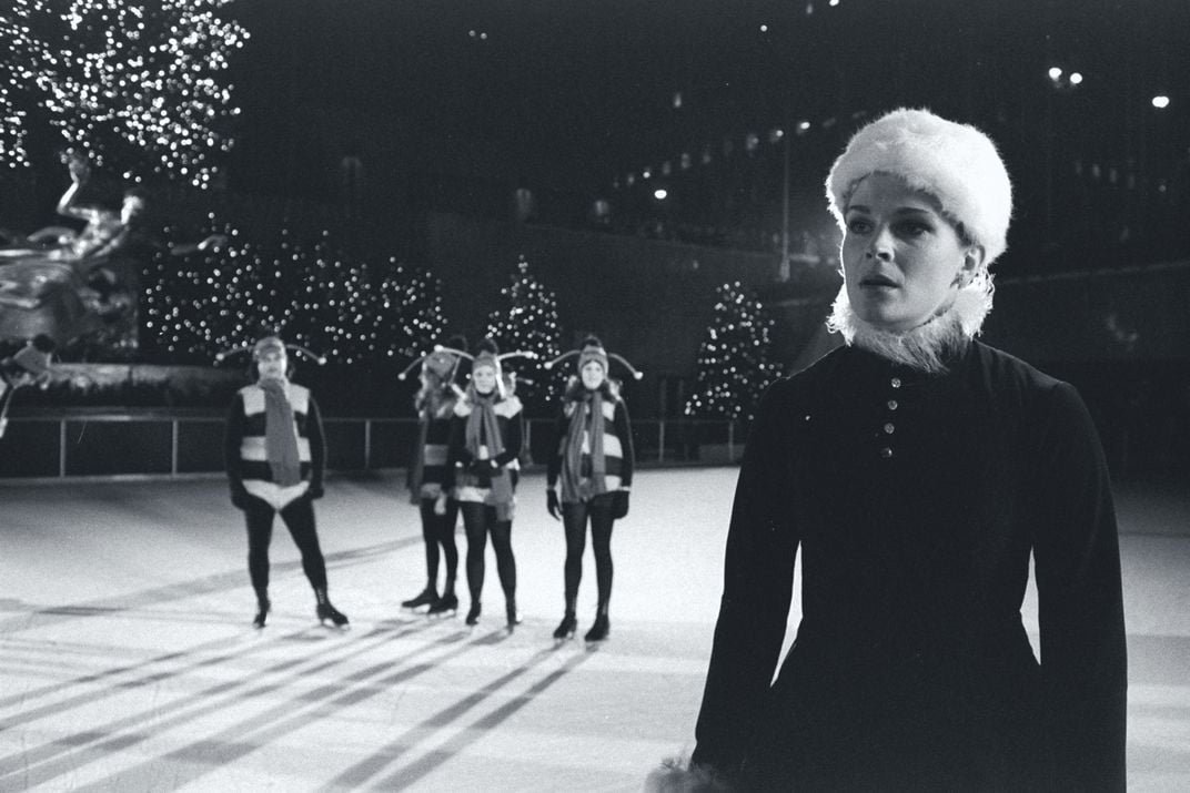Candice Bergen (right foreground) dons a Santa's helper costume and skates for a "Saturday Night Live" skit.