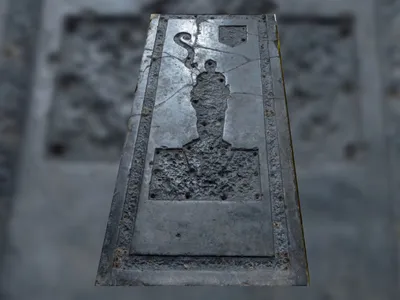 The black &quot;marble&quot; tombstone is made of limestone that likely came from Belgium.
