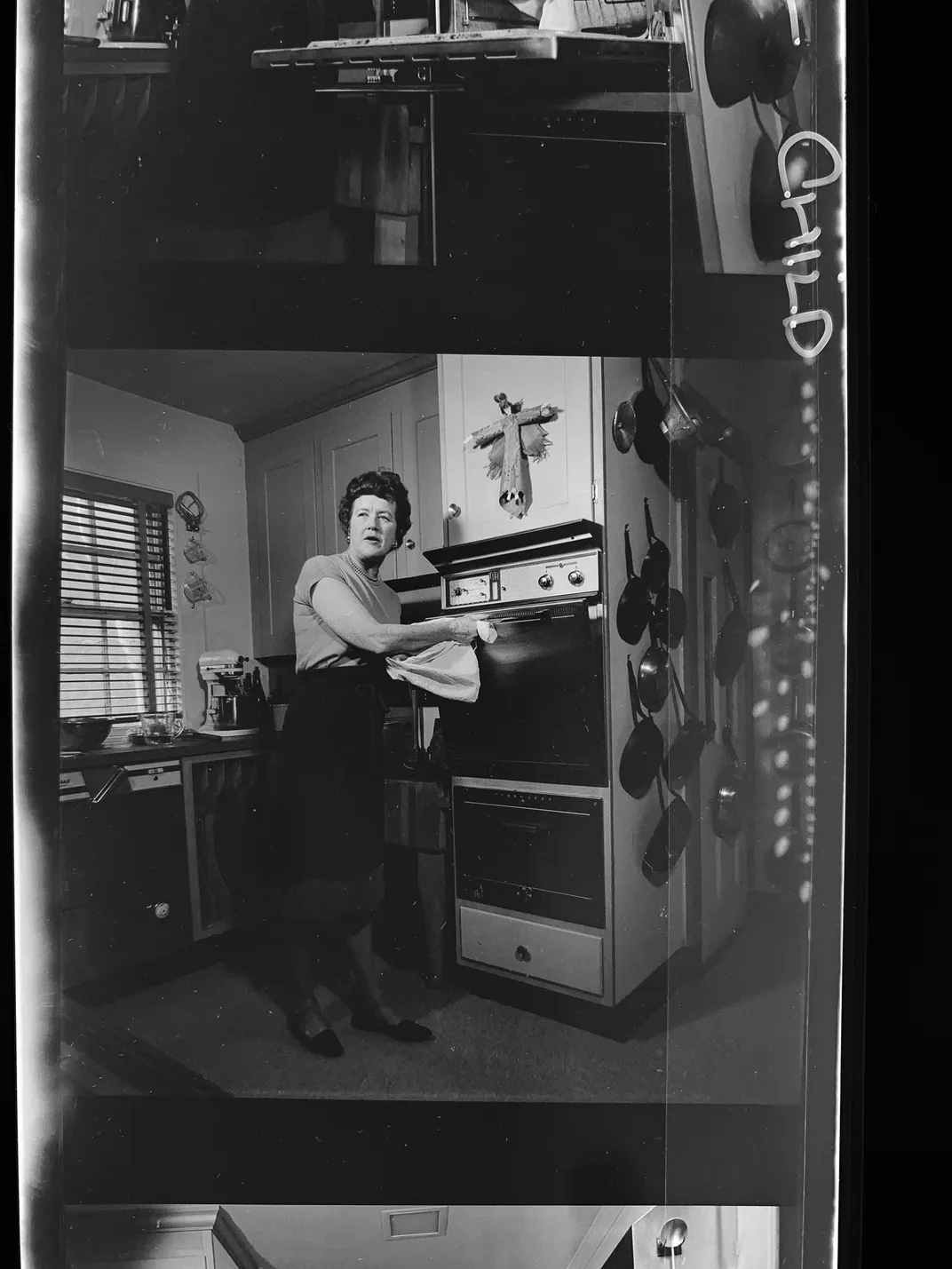 Julia Child in the kitchen, from page 5